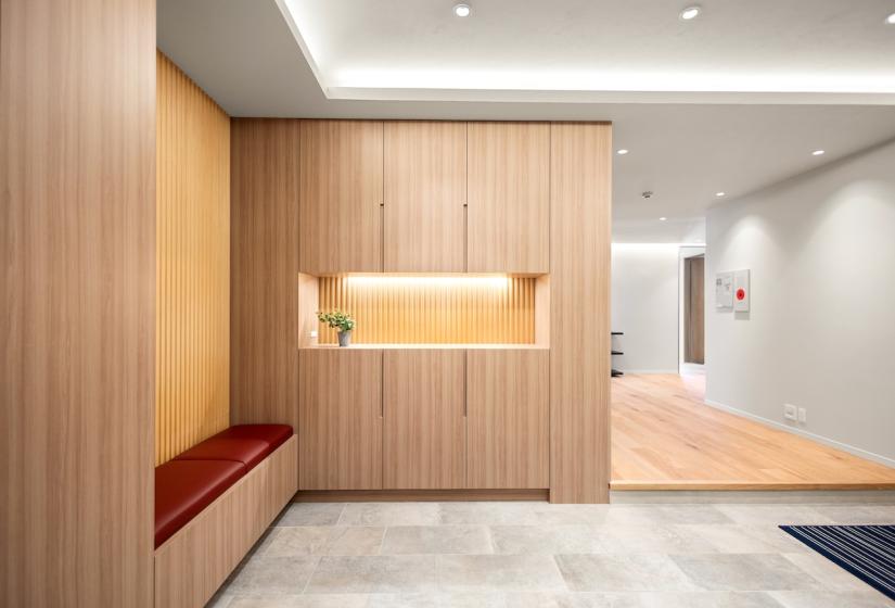 An entry way with light grey tiles