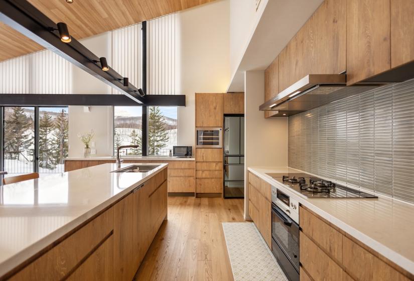 A kitchen with creme counter tops
