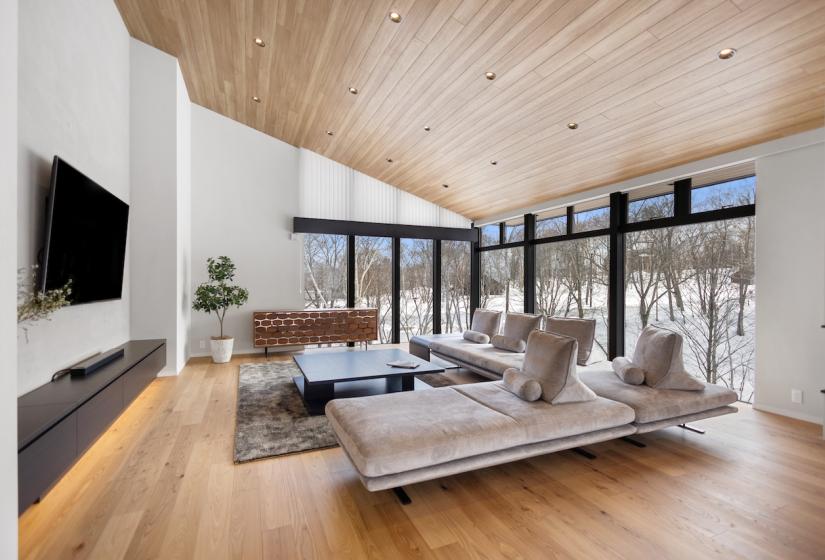 A lounge suite and TV to the left