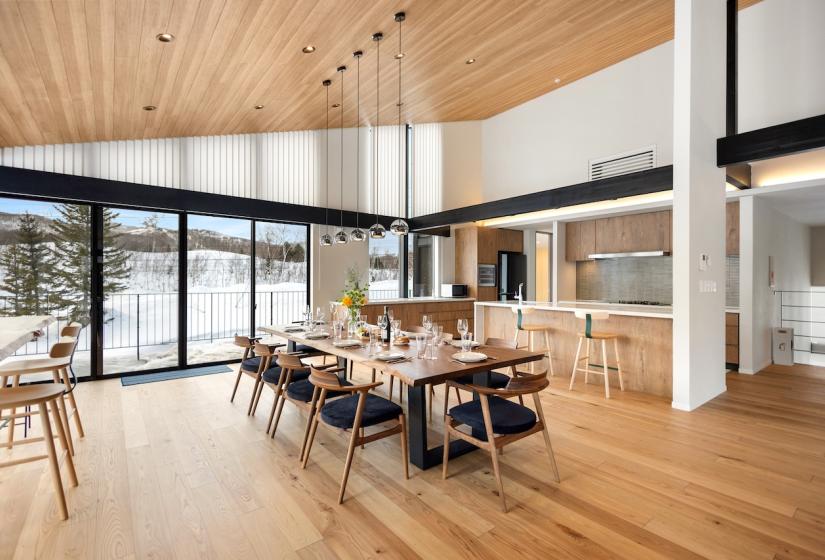 A set dining table and windows behind