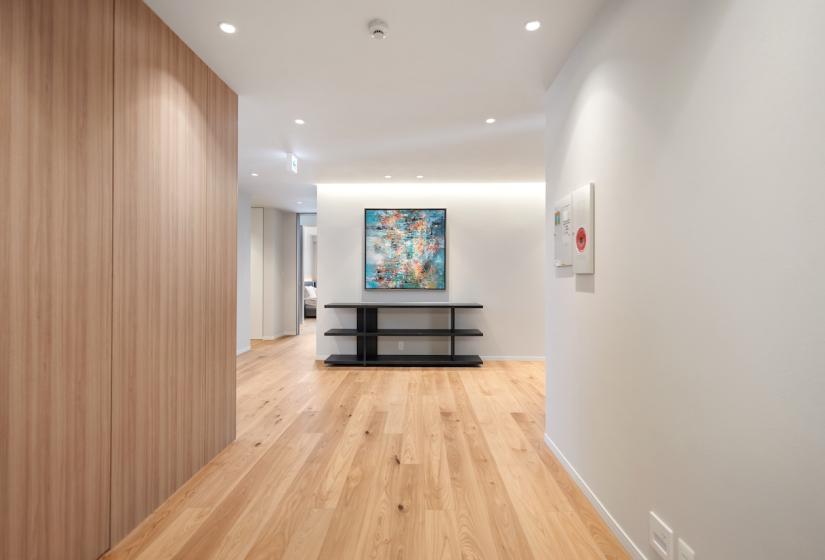 A wide hallway with painting at the end