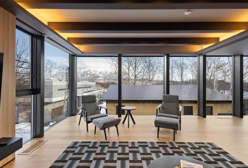 Two large chairs with windows behind