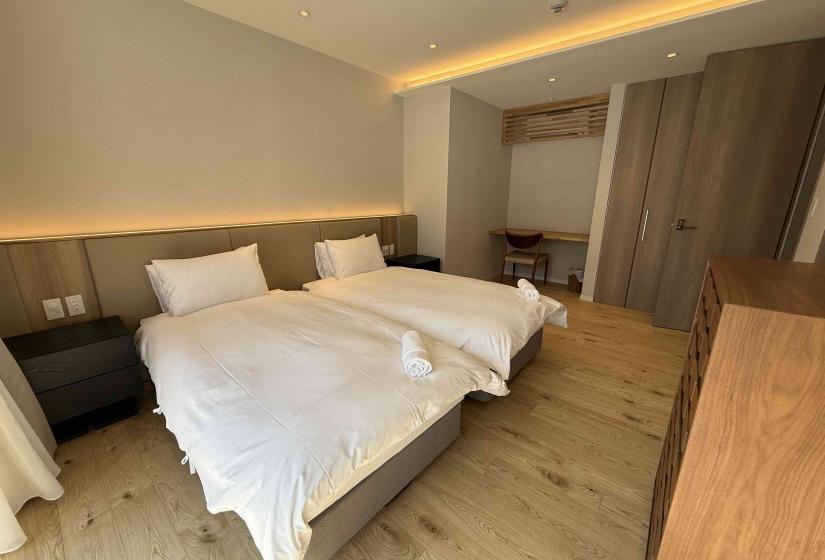 Two made up single beds