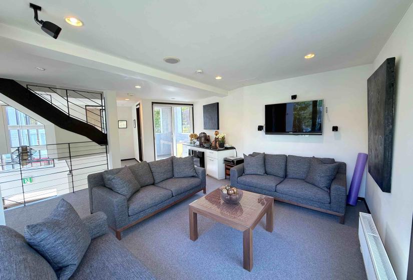 A blue grey lounge suite and coffee table