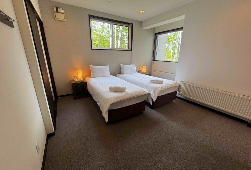 Two beds in a large room