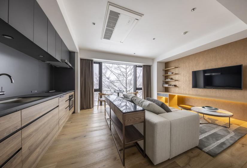 A couch and kitchen to the left