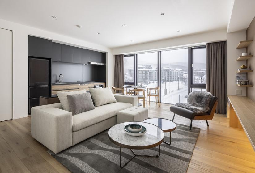 A sofa and arm chair to the left