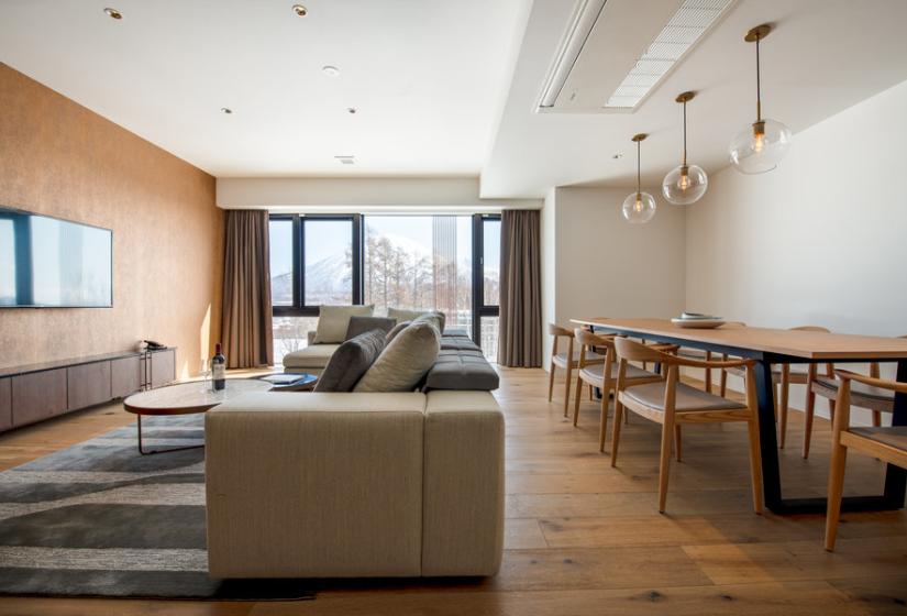 A sofa and dining table to the right