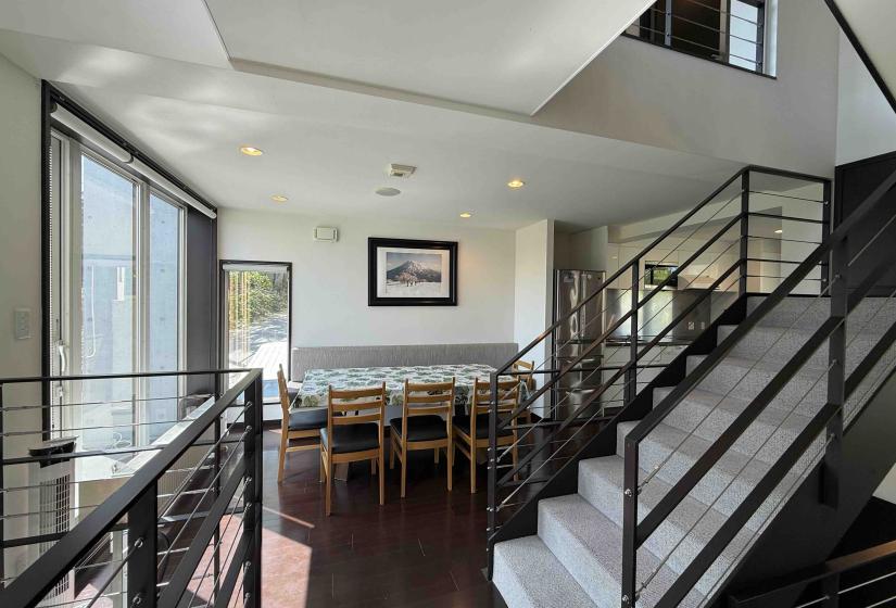 Stairs and dining table behind
