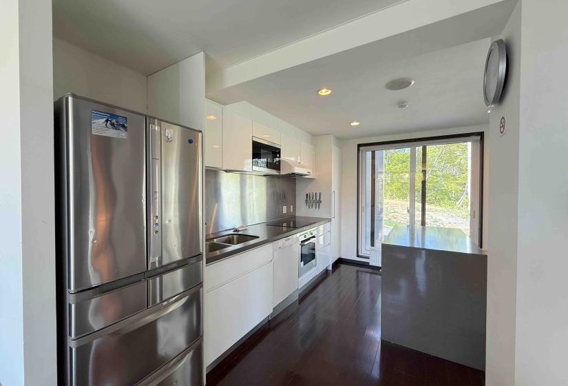 A fridge and white kitchen
