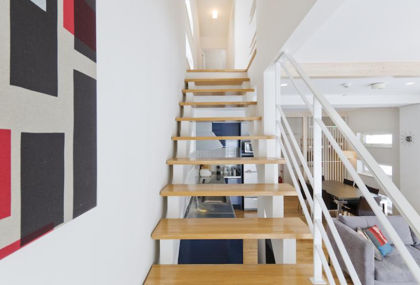 A staircase and picture to the left