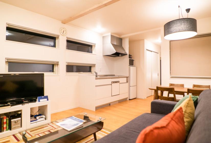 A lounge and TV in front