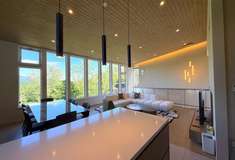A kitchen bench with pendant lights above