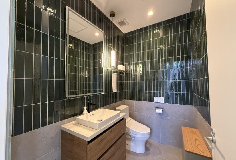 A green tiled toilet