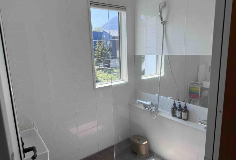 A white tiled bathroom