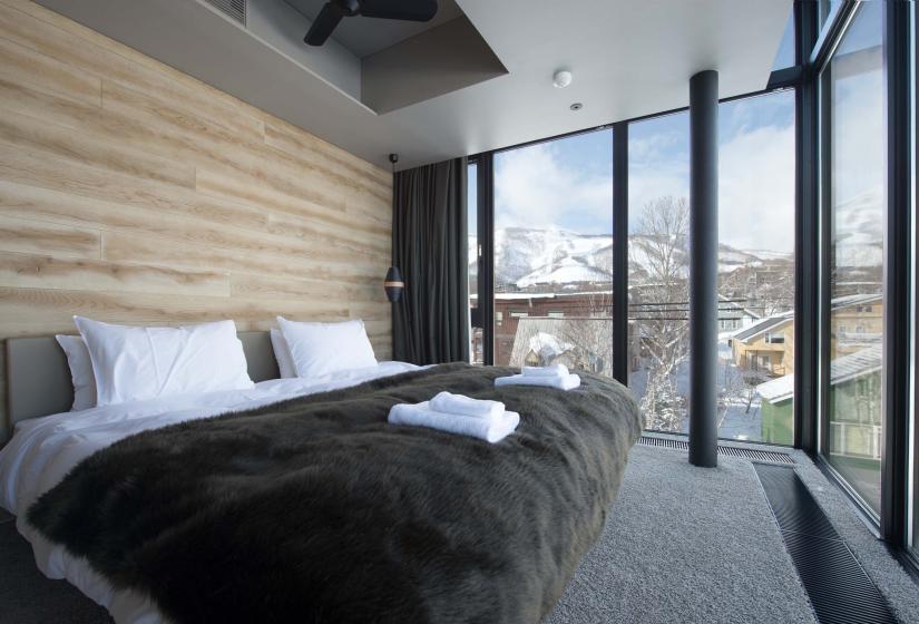 A bedroom with mountain views
