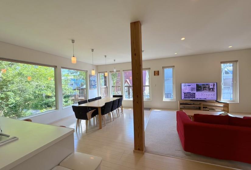 A dining table and couch to the right