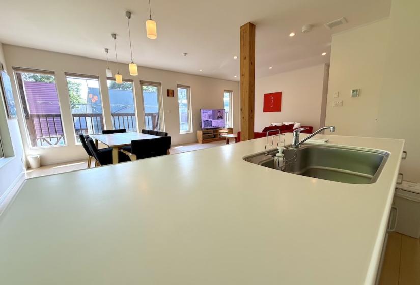 The view across a kitchen bench to the dining table