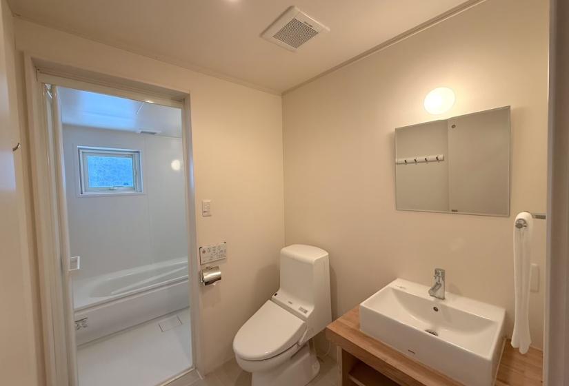 A bathroom sink and toilet