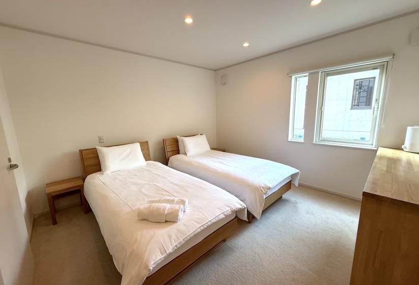 Two made up single beds