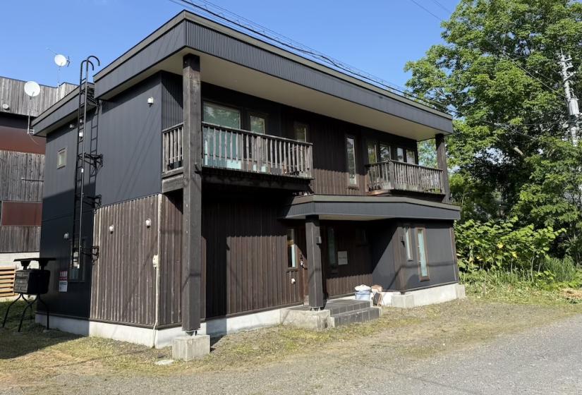 A two story house with 2 balconies