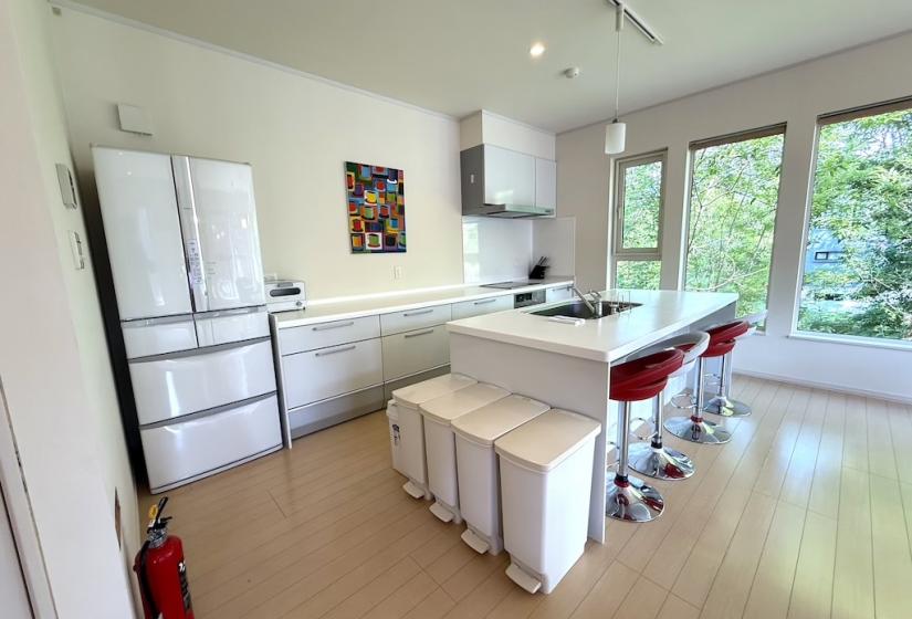 And island kitchen and fridge to the left