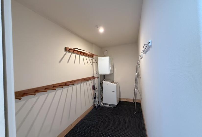 A simple ski room with empty racks on the wall
