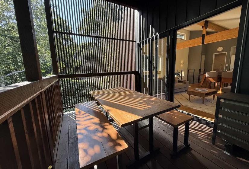 A picnic table on a semi covered deck