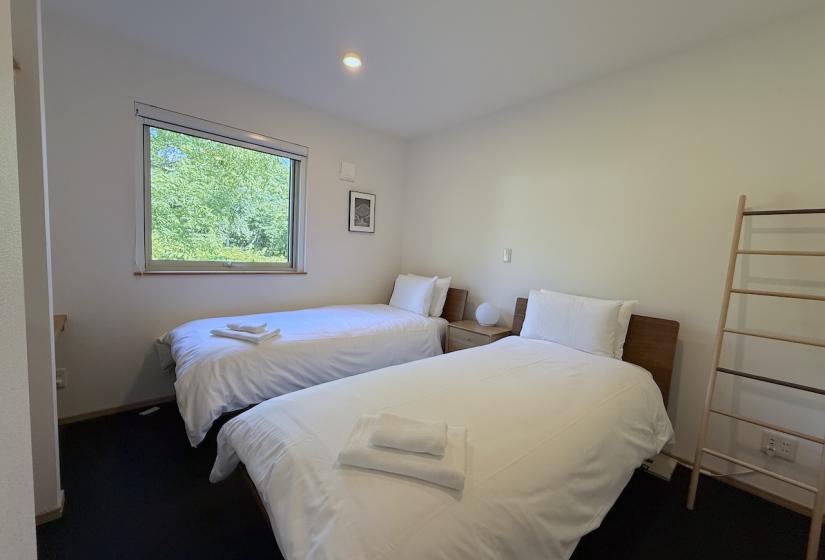 Two made up single beds