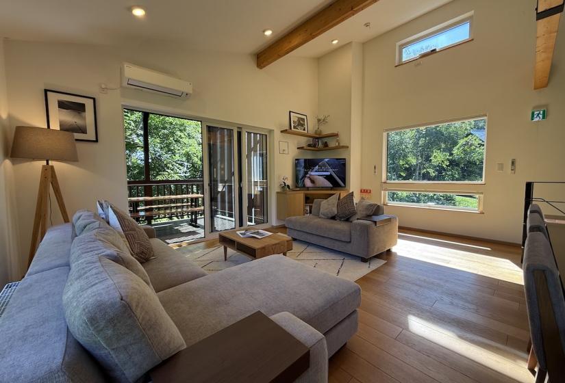A lounge suite with a TV in the corner