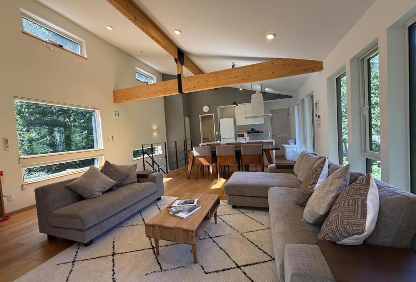 A lounge suite and kitchen behind