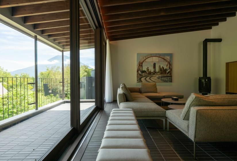 Setsuei Niseko lounge opening onto a balcony with Mt Yotei views