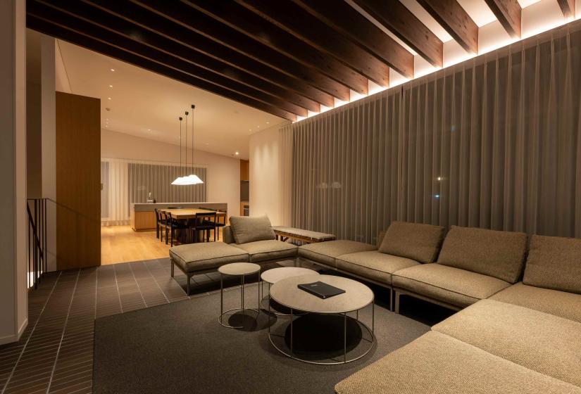 A lounge suite with rafters over head
